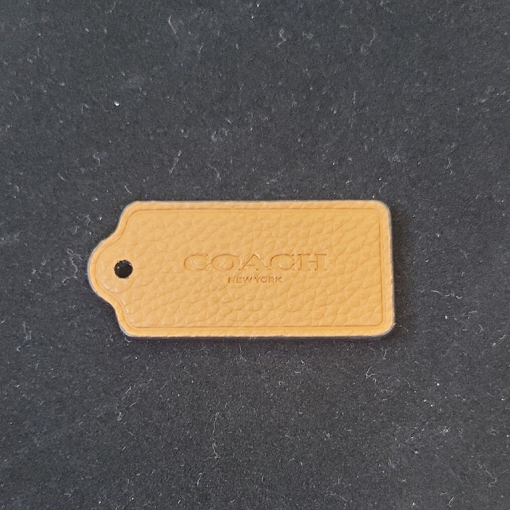 Coach: Tan Pebbled Leather Bag Tag without chain